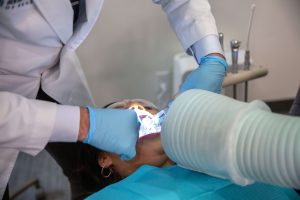 Patient getting her teeth extracted