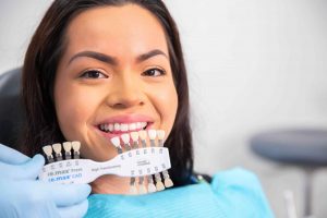 Patient showing the progress of her teeth whitening.